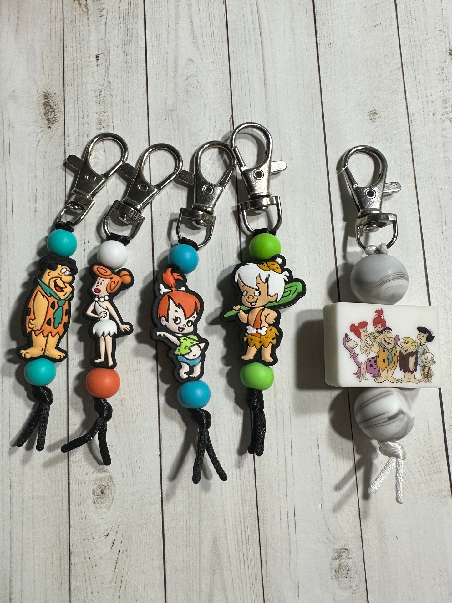 Stone Age Movie Zipper Pulls